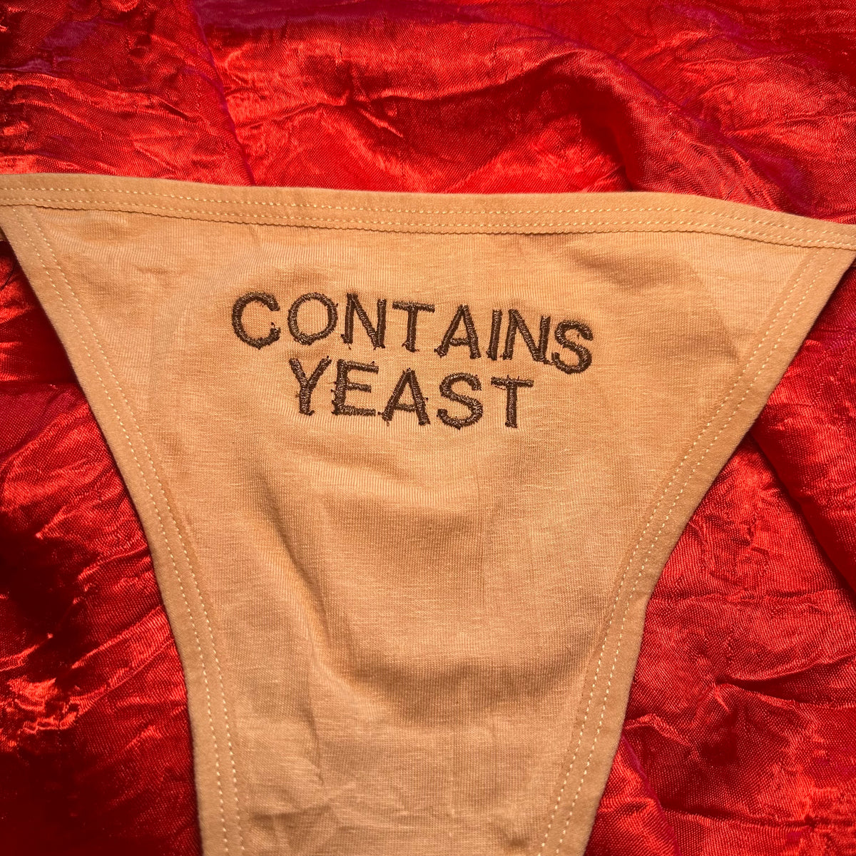Contains Yeast Thong (L) beige/brown
