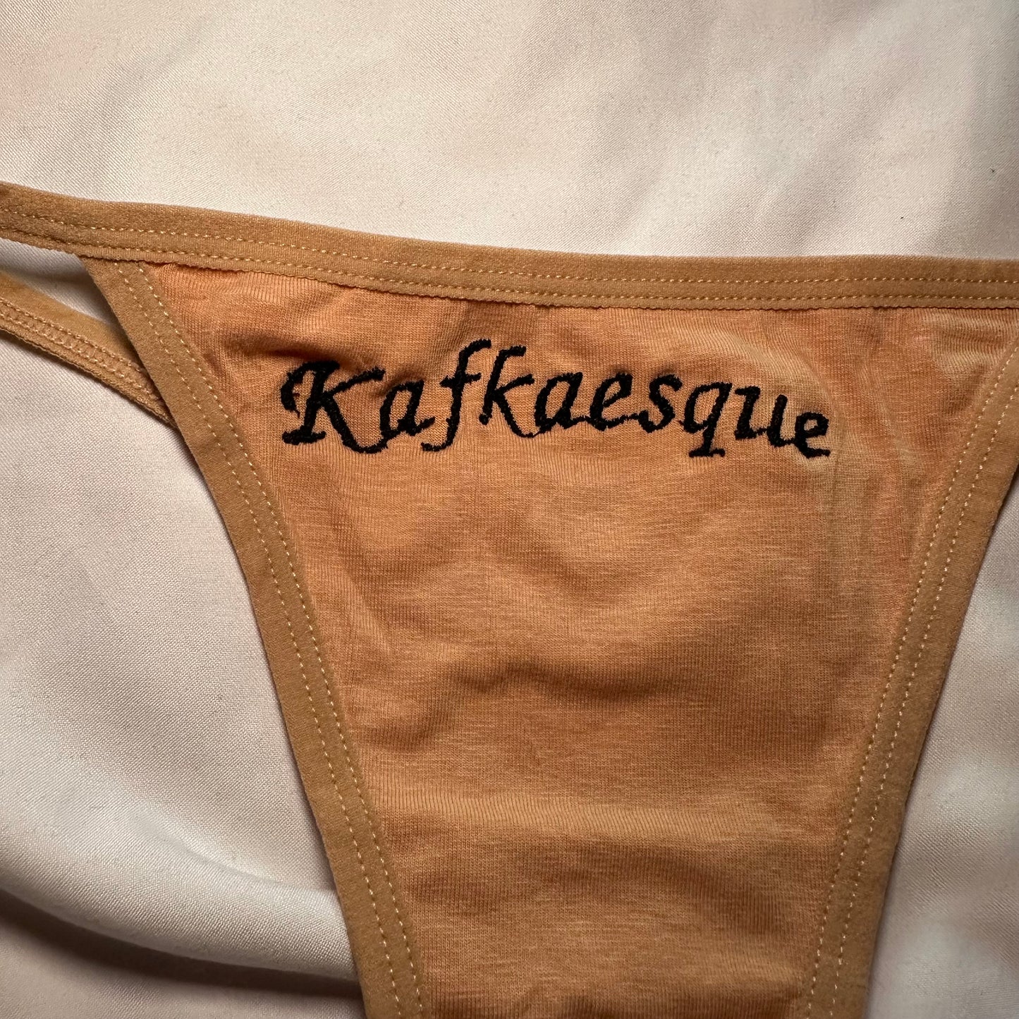 Kafkaesque Thong (S) beige/black