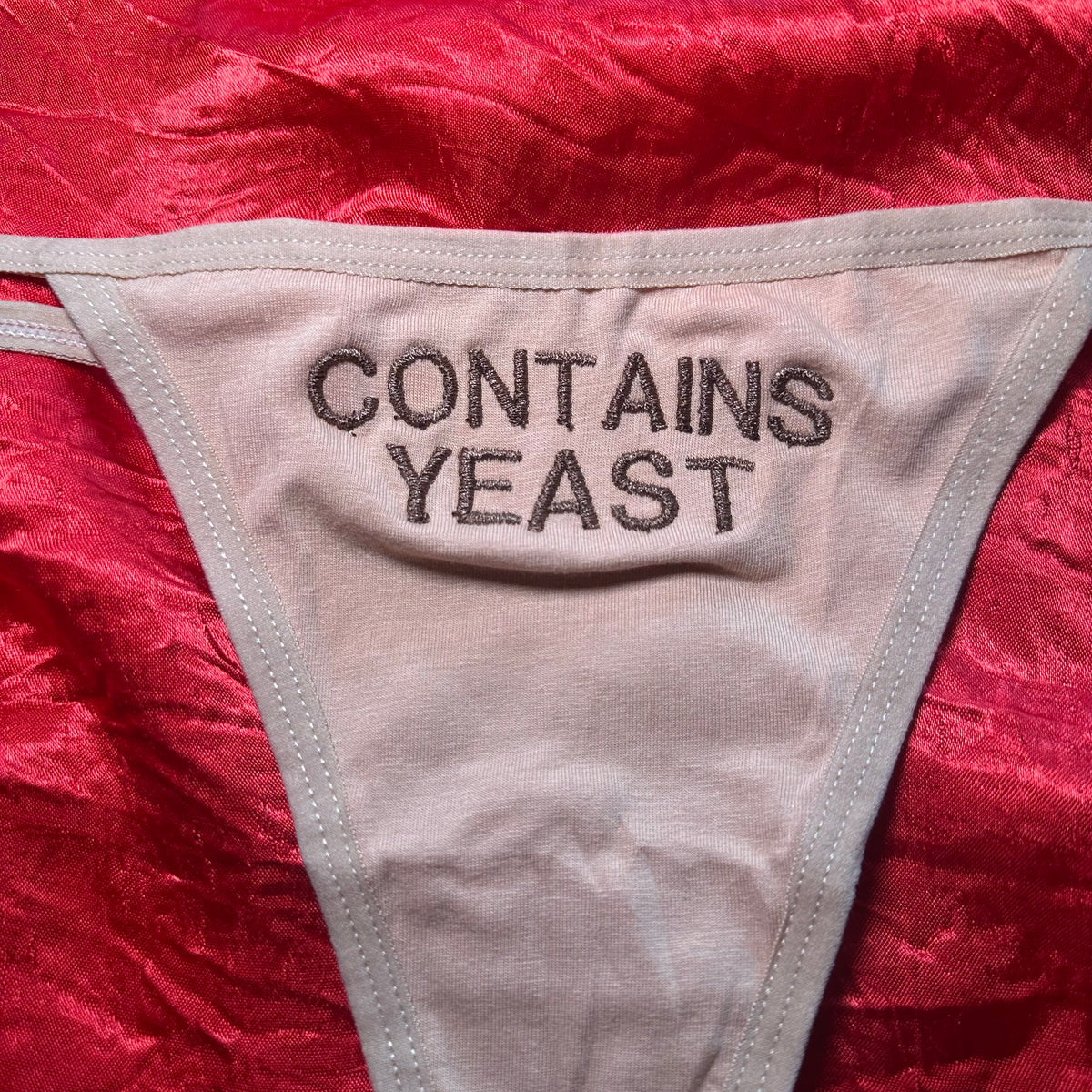 Contains Yeast Thong (S) beige/brown