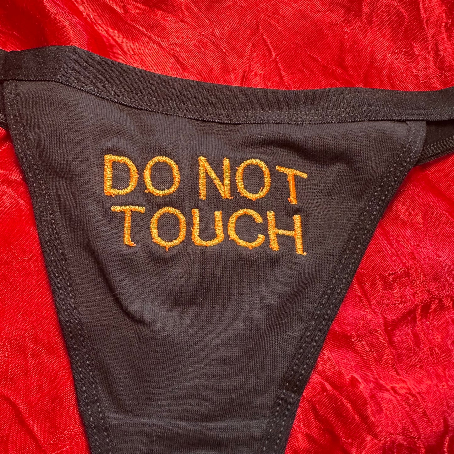 Do Not Touch Thong (XL) black/orange