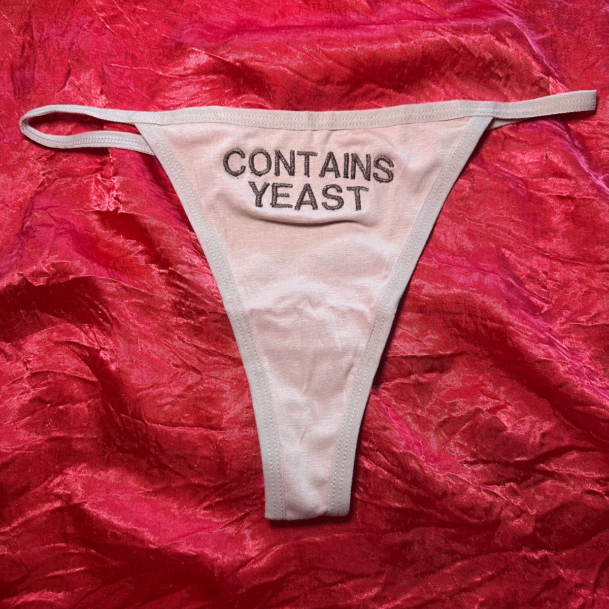 Contains Yeast Thong (S) beige/brown