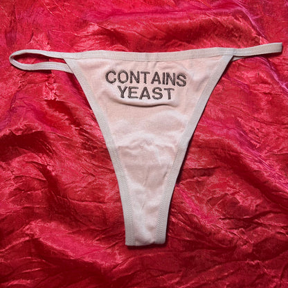 Contains Yeast Thong (S) beige/brown